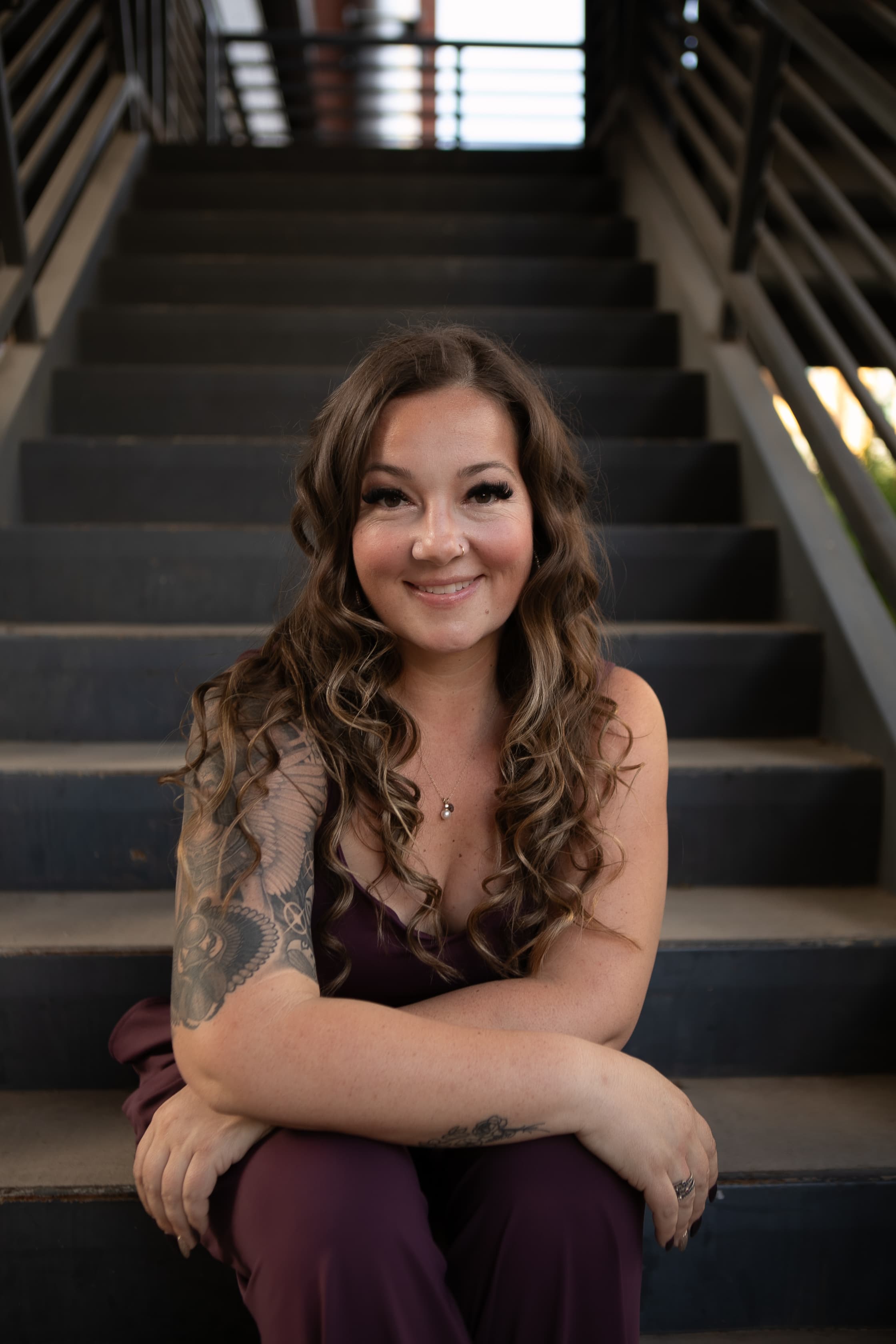 Kaleigh Williams, seated portrait with relaxed genuine smile, HiEnergy Consulting